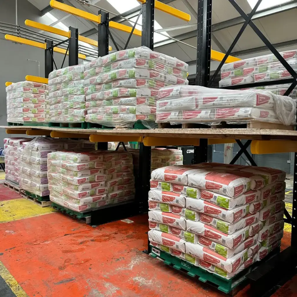 Pallets of bagged plaster and cement in the Builders Megastore warehouse